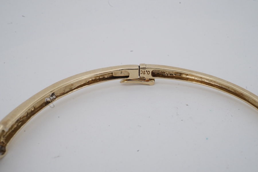 An amethyst and diamond bangle, inner circumference 17.5cm, mounted in gold, gross weight 7 grams; and an Edwardian bar brooch designed as an insect, set with a circular-cut aquamarine and seed pearls, mounted in gold, l